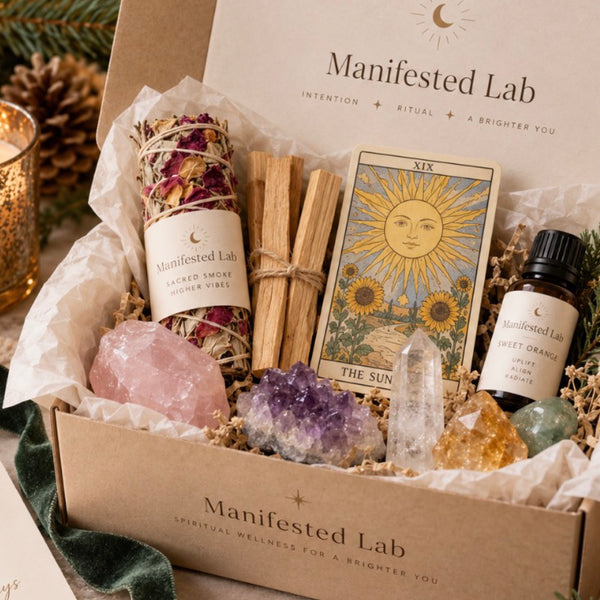 Manifested Lab Holiday Gift Box with sage, palo santo, tarot card, essential oil and crystals