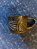 Manifested Pottery 1 - handmade gold glazed carved mug